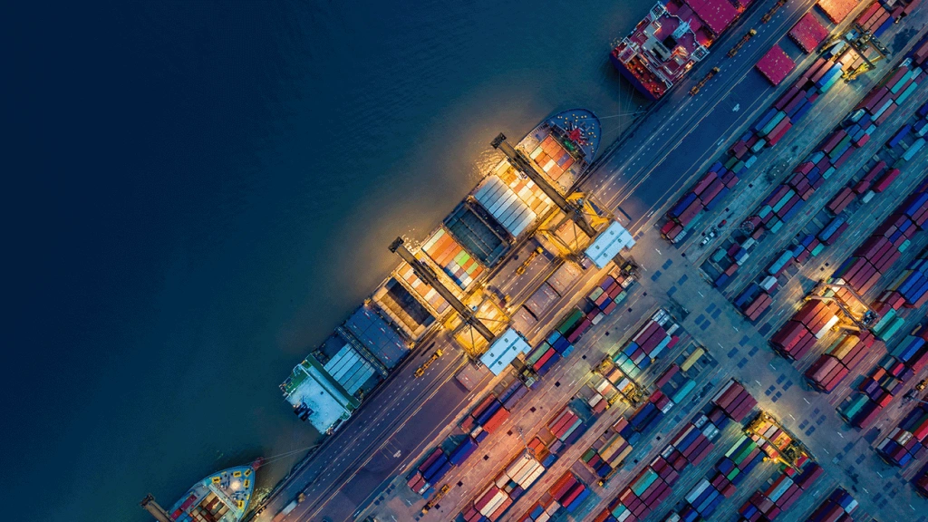 aerial view of a seaport with shipping containers in reference to supply chain compliance