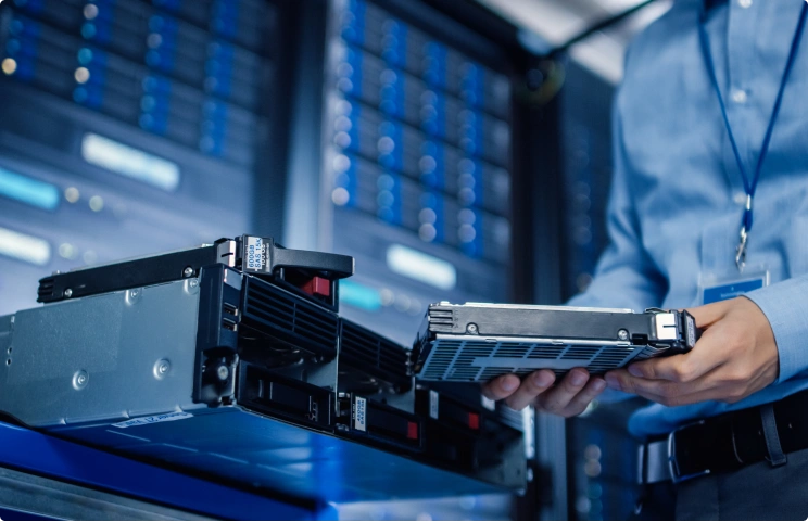 An IT worker inspecting controlled technology