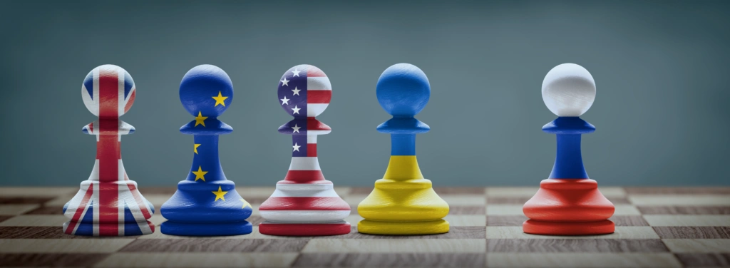 The US, EU, and UK standing with Ukraine, they are represented by chess pieces imposing sanctions on Russia
